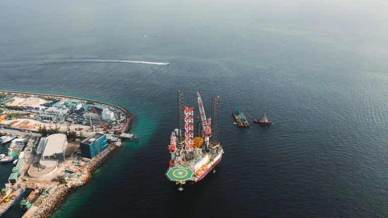 Offshore drilling rig near a coastline